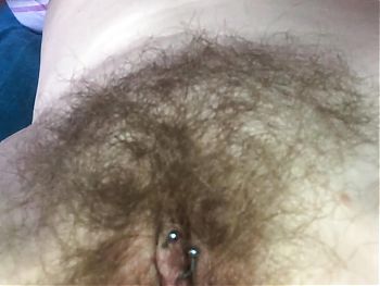 Filthy MILF fingers her furry fanny whilst talking flesh fetishes